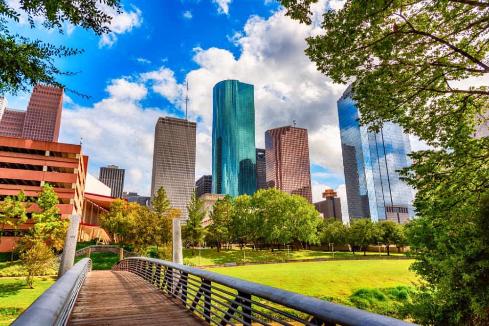 Footbridge into Downtown Houston with huge buildings