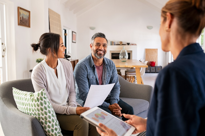 A couple talking to a financial advisor