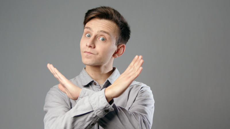 A man making a cross with his arms